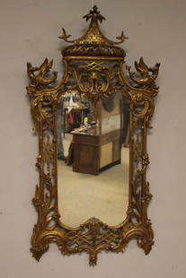 18th Century George III Gilt Mirror: Fine carved gilt 18th century or very early 19th century gold gilt wall mirror. Highly carved and detailed with a slight Asian influence with a pagoda style crest flanked by two Ho-Ho birds. The Ho ho