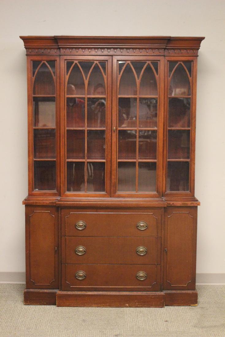 1940's Mahogany China Cabinet: Mahogany china cabinet, circa 1940's in the style of Duncan Phyfe. Approx. 76"t. x 51"w. x 15"d. Overall fair condition, see photos for finish loss on base.
