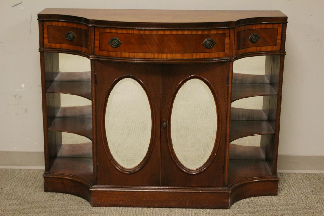 1940's American Mahogany Hall Cabinet: Duncan Phyfe style 1940's inlaid mahogany hall cabinet. Banded drawers with two lower mirrored doors with shelves on side. Measuring approx. 34" tall 44" wide 17" deep. Overall condition is consistent