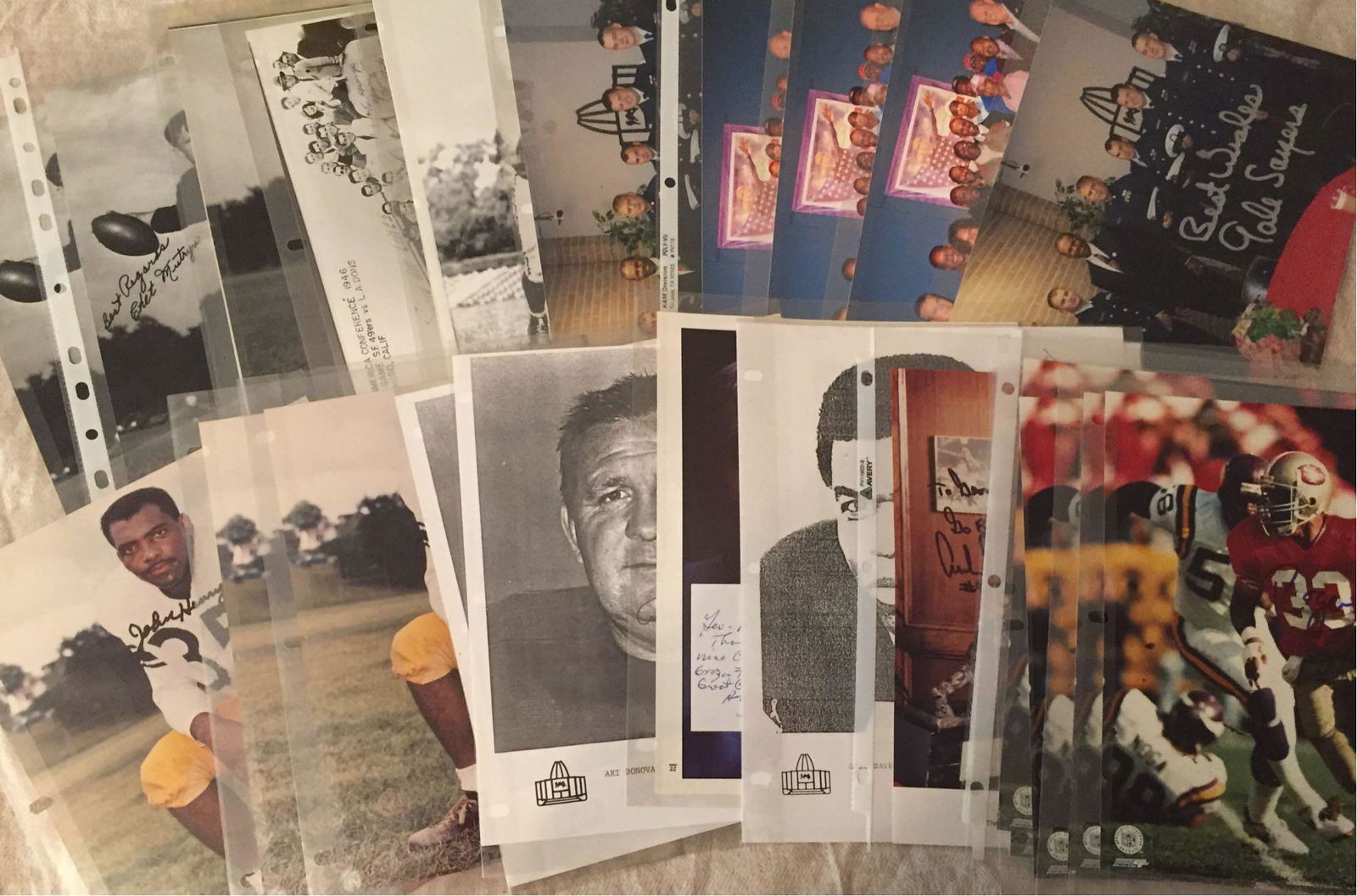 Collection of Autographed Football 8x10's: (28) autogaphs in all on various mediums. Roger Craig, Gayle Sayers, Art Donovan, John Henry Johnson and others. There are multiples of some players. Comes with an Auction House LOA from James Spence