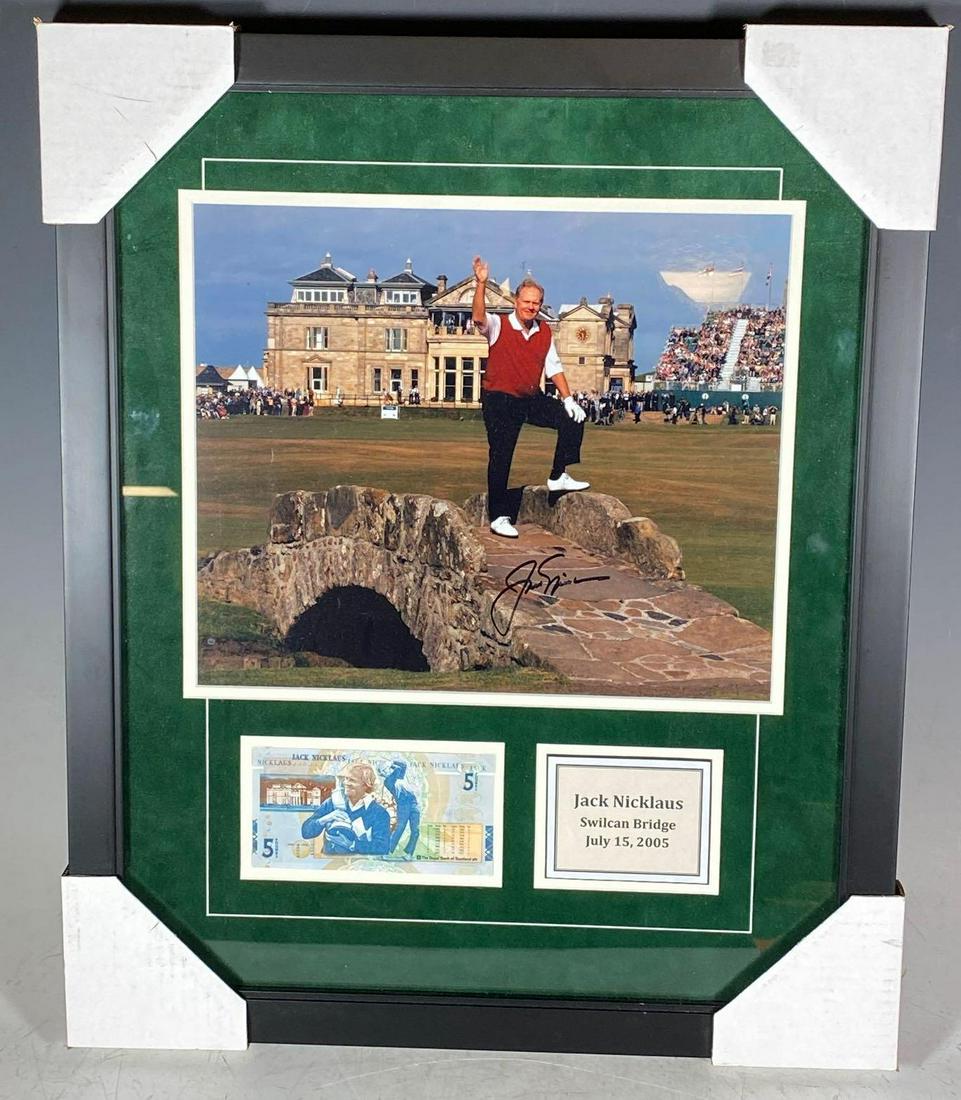 Jack Nicklaus Autographed Photo Display JSA: A little over 22x18 display includes what appears to be an 11x14 color photo of Jack posing in grand fashion on the Swilcan Bridge. This is the famous 18th hole at St. Andrews. Amazing display that al