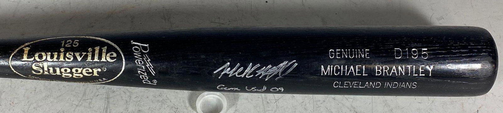 Michael Brantley Signed and Inscribed Game Used Bat: Louisville Slugger D195 model black finish bat. Knob garnishes factory date of 5/18/2009 and "33.5/31oz." small sampling of pine tar and contact marks. Spiltering below the LS trademark. Great signatu