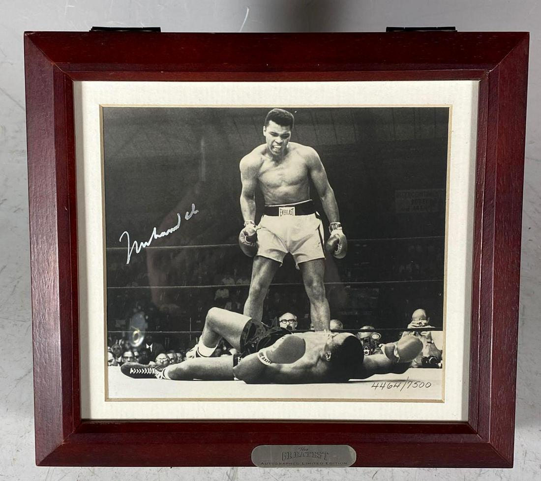 Muhammad Ali Signed LE Fossil Watch Display 1993: Approx 8.5 x 9.5 x 2 inch display in a redish brown tone. Features the iconic image of Ali Standing over Liston in black and white. Silver signature in the perfect spot. Limited Edition #4464/7500 in 