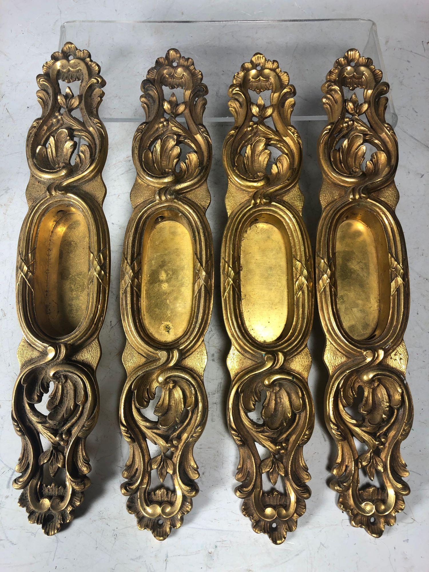 French Victorian Style Pocket Door Handles: French style molded brass pocket door handles, marked on bottom "P.E.G." and 653. L 12.5" x W 2.5" x D 1". Â