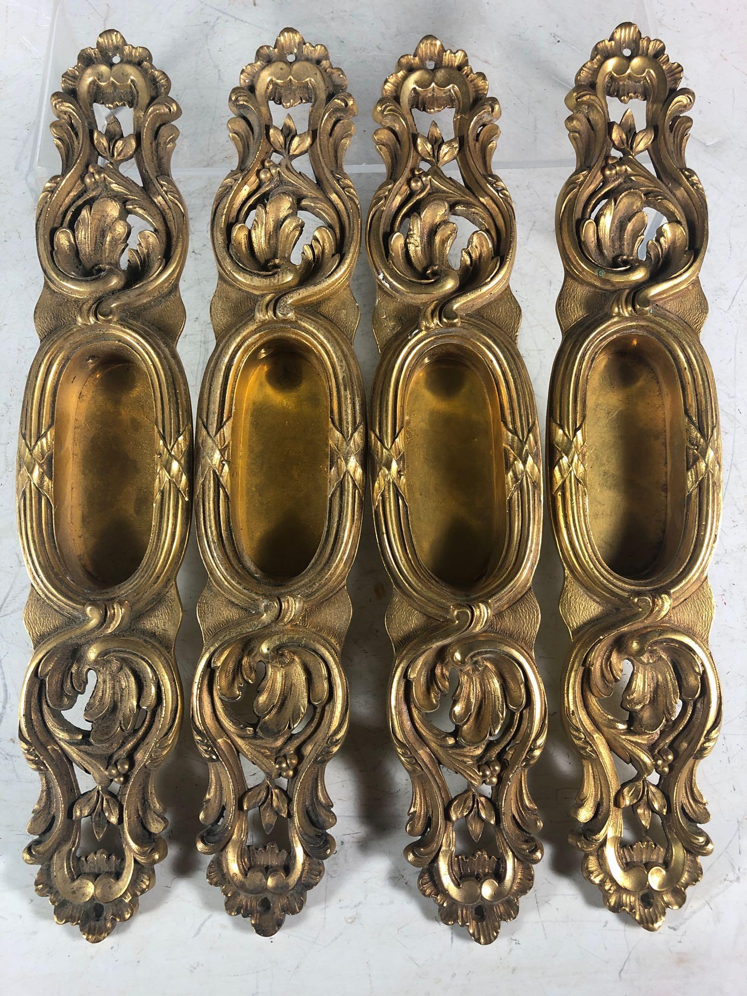 French Victorian Style Pocket Door Handles: French style molded brass pocket door handles, marked on bottom "P.E.G." and 653. L 12.5" x W 2.5" x D 1".