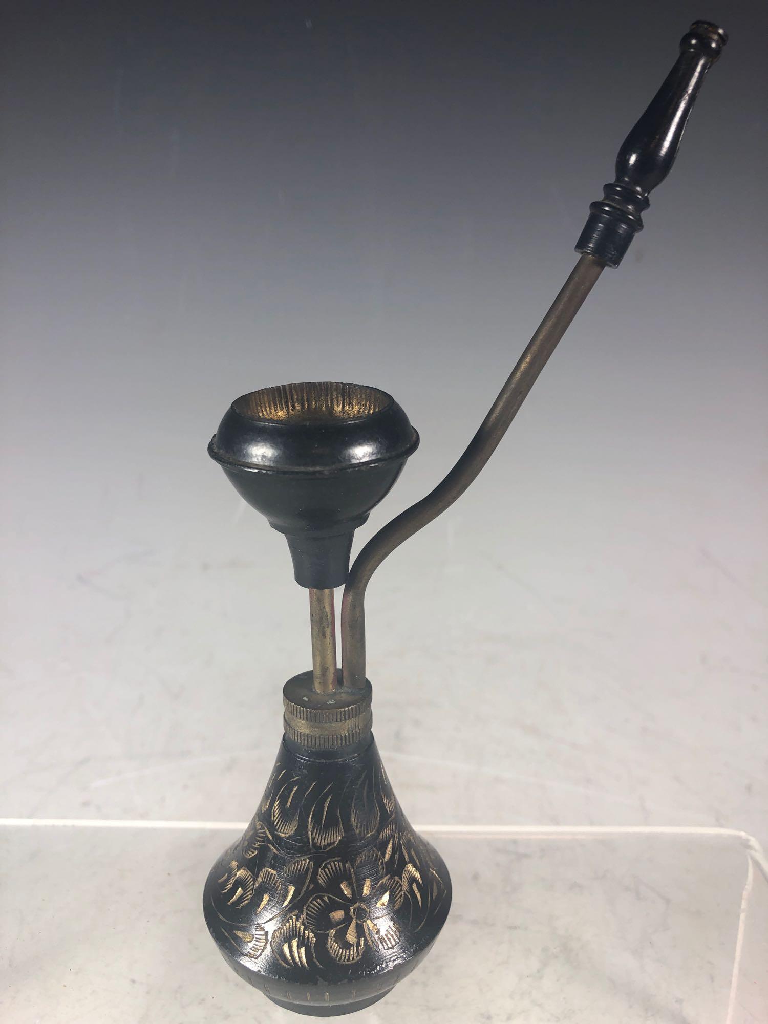 20th C. India Smoking Pipe: Black ebony with gold incised decorated body, brass stem.Â Marked on base as shown.Â India Opium or hash cultural smoking pipe.Â Standing approx 7.5" tall and in used good condition as shown,