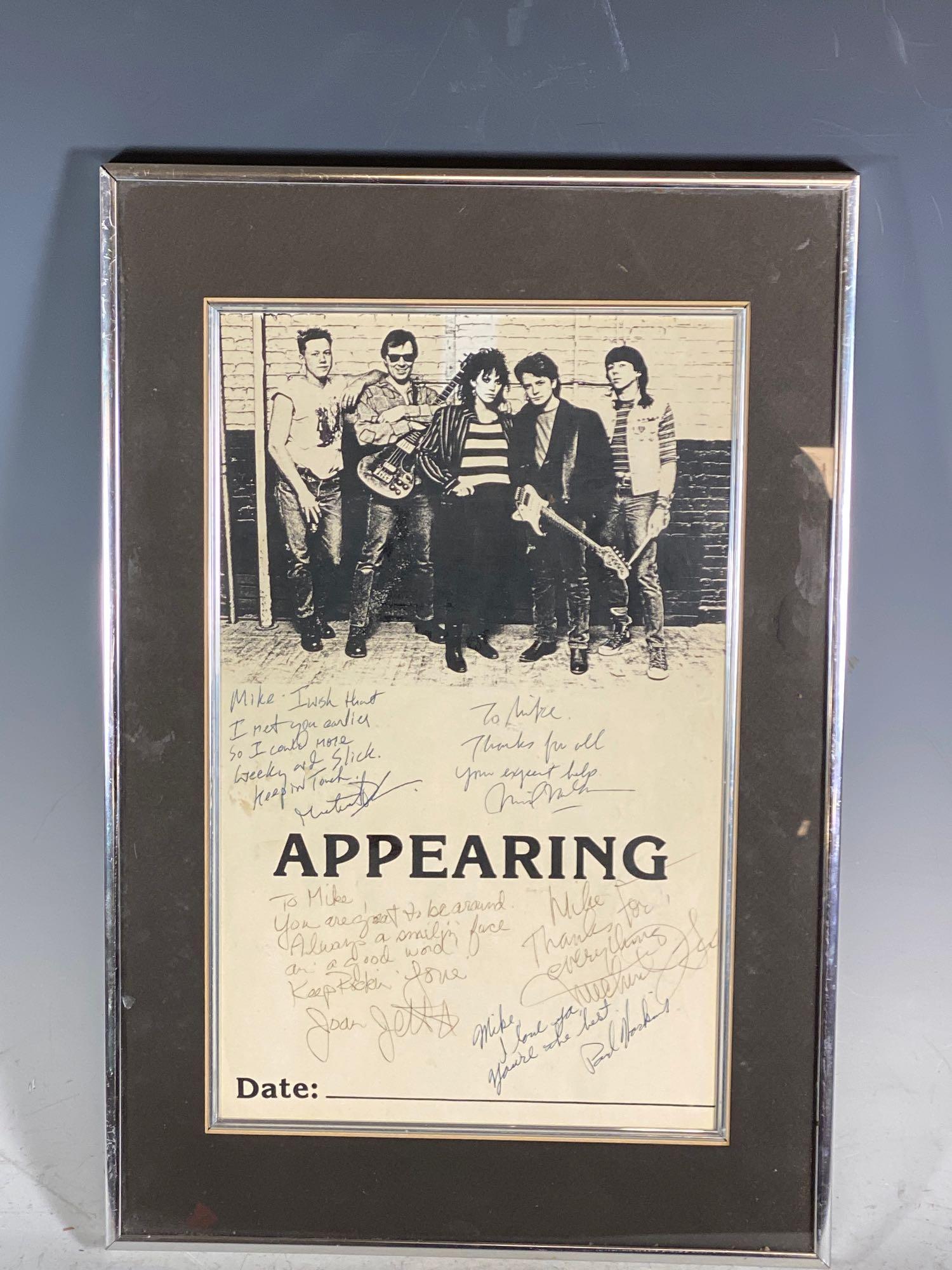 Michael J. Fox & Joan Jett Signed 1987 Light of Day: Approx 18x12 framed and matted lobby style poster from the movie, Light of Day. Features the members of the band from the movie including Joan Jett and Michael J. Fox. Black and what piece from the mo