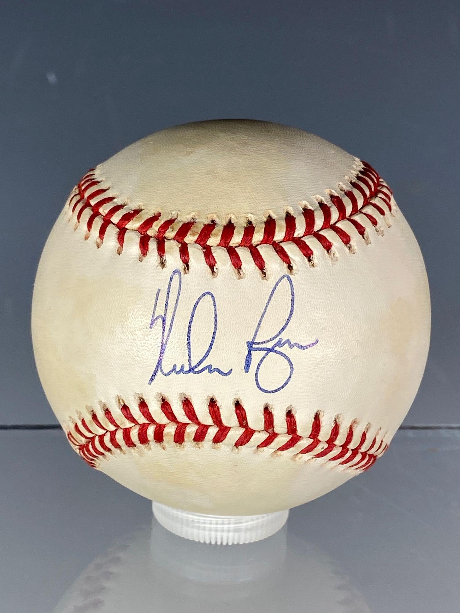 Nolan Ryan Autographed Baseball: Official Bobby Brown baseball signed on the sweet spot in blue pen. High quality signature by the HOF'er. Comes in a baseball stand. Comes with an Auction House LOA from James Spence Authentication.