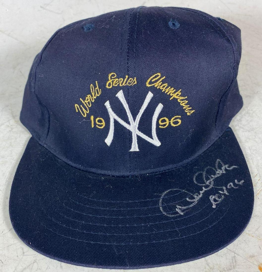 Derek Jeter Signed and Inscribed "ROY 96" World Series: 1996 World Seried Champions hat signed in silver by Jeter along with 'ROY 96" inscription. Nice, large early signature from the generational icon! Great itemt o display. Comes with a cert from JSA.