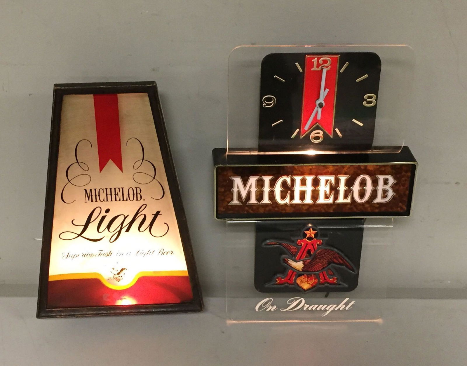 Michelob and Michelob Light Lites Breweriana: Two working lighted advertising pieces. One is an older Michelob Light that lights from the bottom. Second is a Michelob clock.