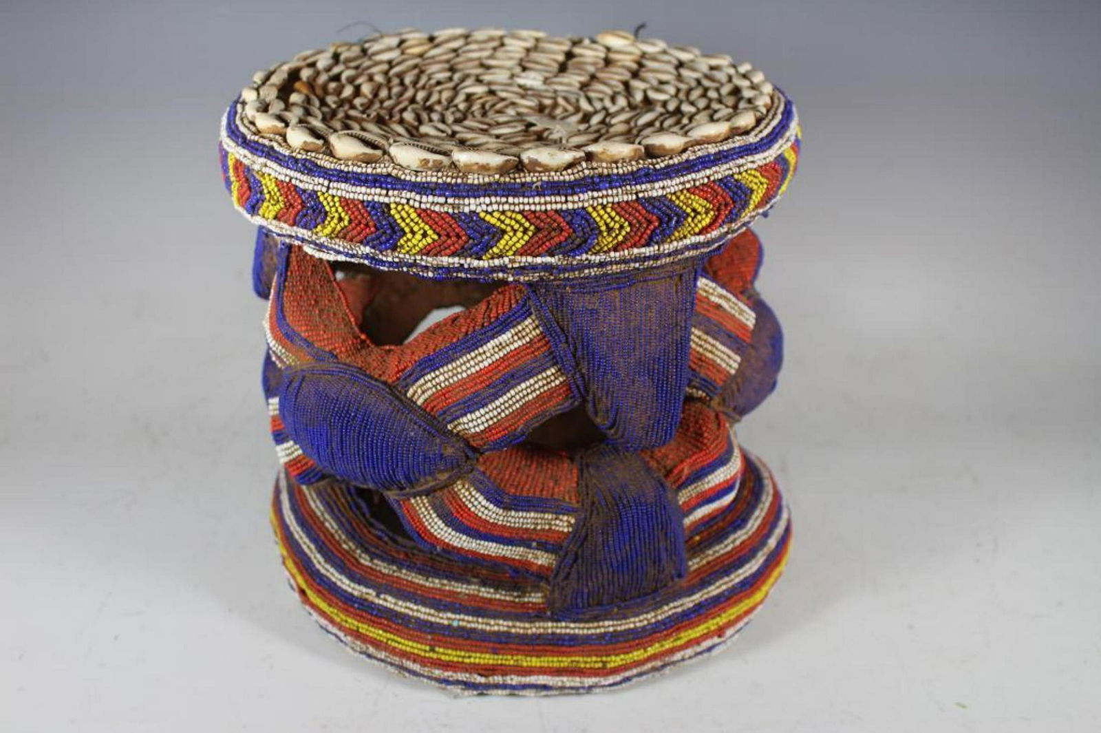 YORUBA Beaded African Stool: Ornate beaded African stool with shell seat or top as shown. Measuring approx 12" tall x 13" dia. Condition is good as shown, see photos. Beaded Bamileke Stool, Cameroon | Most Bamileke art (and the w