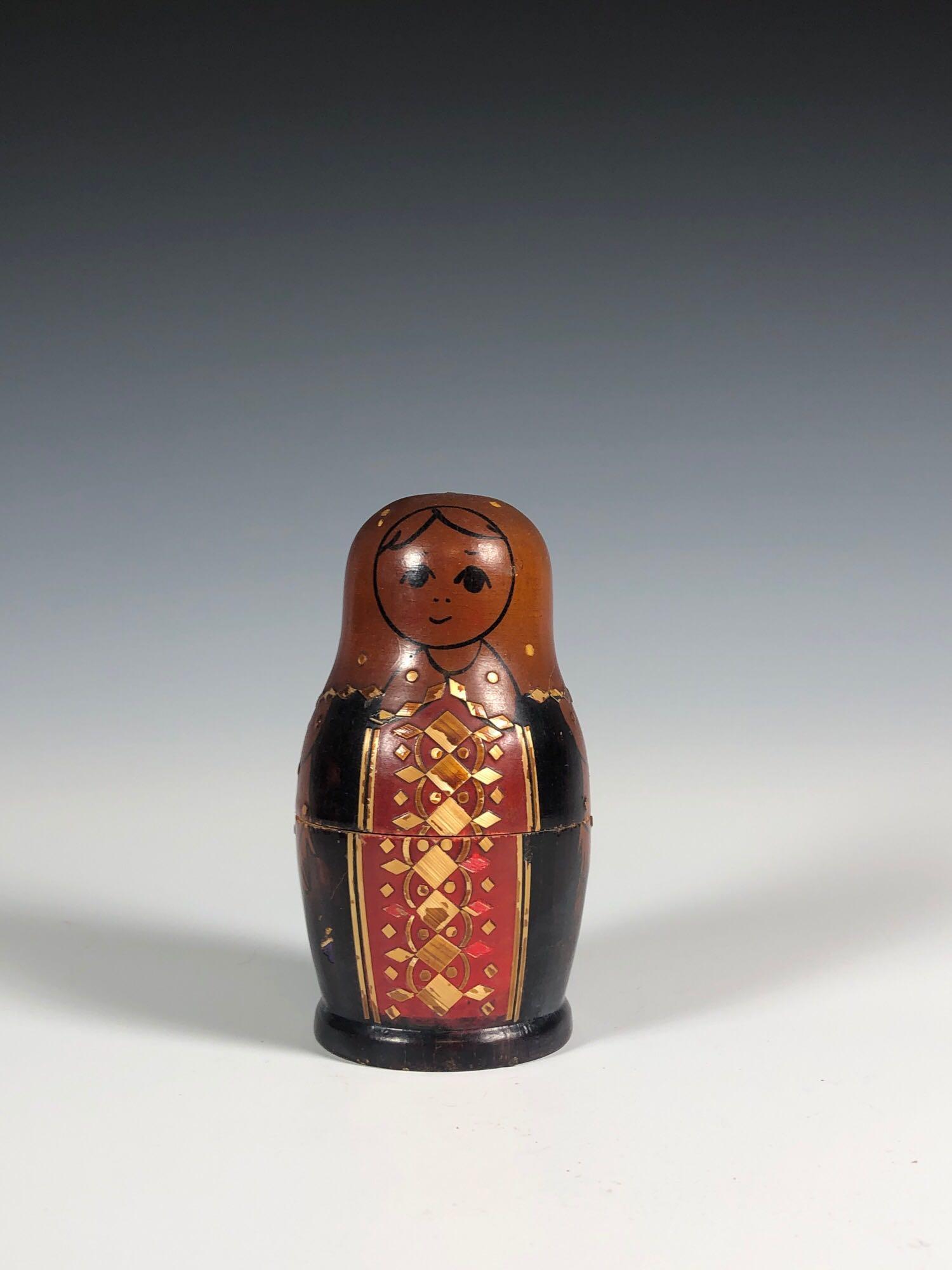 Matryoshka Doll or Russian Nesting Dolls: Matryoshka Doll or Russian wooden hand painted nesting dolls. Measuring approx 4.5" tall. Some light wear to largest doll as shown, see photos.
