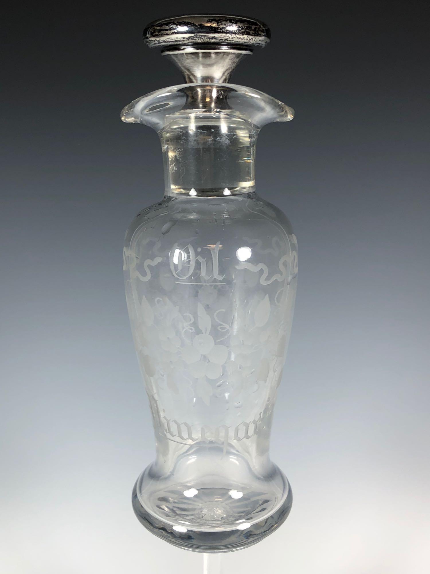 Sterling Silver Capped Hawkes Oil Vinegar Bottle: Early 1900s Hawkes oil vinegar bottle with sterling silver capped stopper. Bottom of bottle marked Hawkes with 2 patented dates of 1914 and 1916. Approx. 8" tall in good age appropriate condition, see