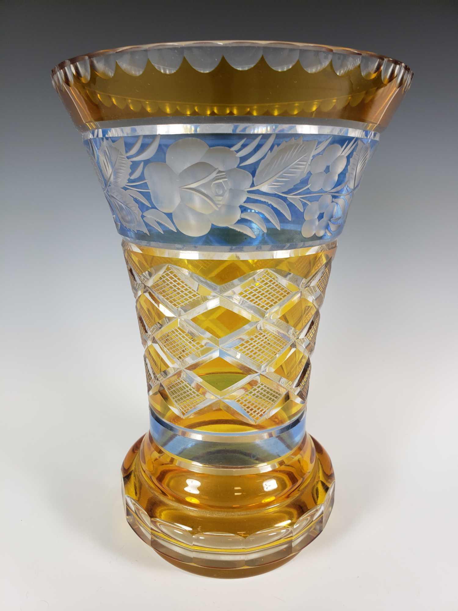 Bohemian Amber Cut Glass Vase: Fine Amber yellow cut to clear with blue etched glass floral border decorations. Fine Czech Bohemian art vase measuring approx 9" tall. Smooth bottom as shown, no signatures. 