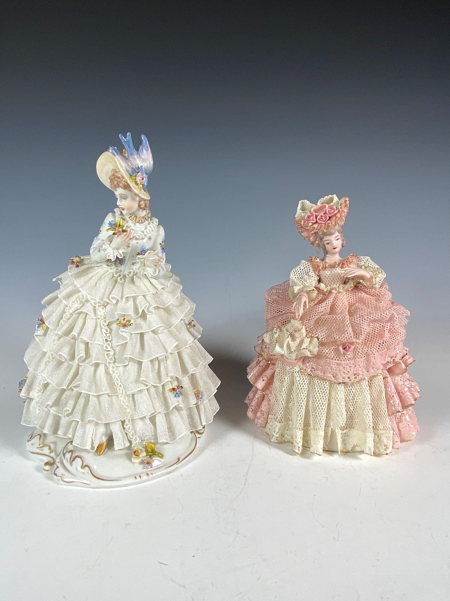 2 Porcelain Lace Women Figurines Dresden and Heirlooms: Includes Dresden Royal Crown E&R heavy porcelain lace lady figurine with flowers and bird on hat, approx. 8" tall with some lace loss as pictured and Heirlooms of Tomorrow numbered PE994 lady in pink 