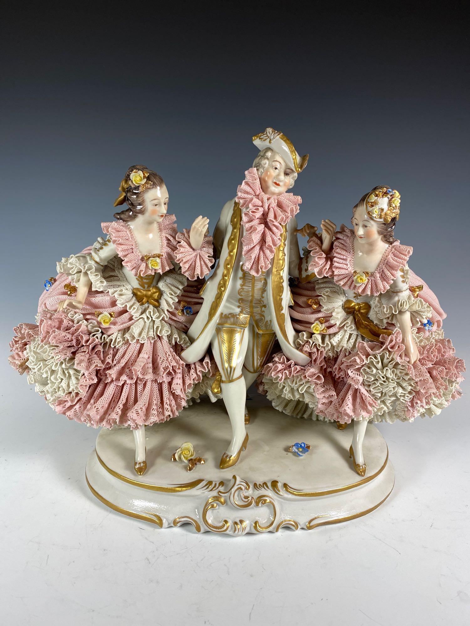 Massive Franz Witter Dresden Porcelain Lace Centerpiece: Massive Franz Witter Dresden Porcelain Lace Centerpiece Figurine. Depicting two heavily laced ladies in 18th. century attire accompanied by a gentleman. marked on top backside base and trimmed in gold
