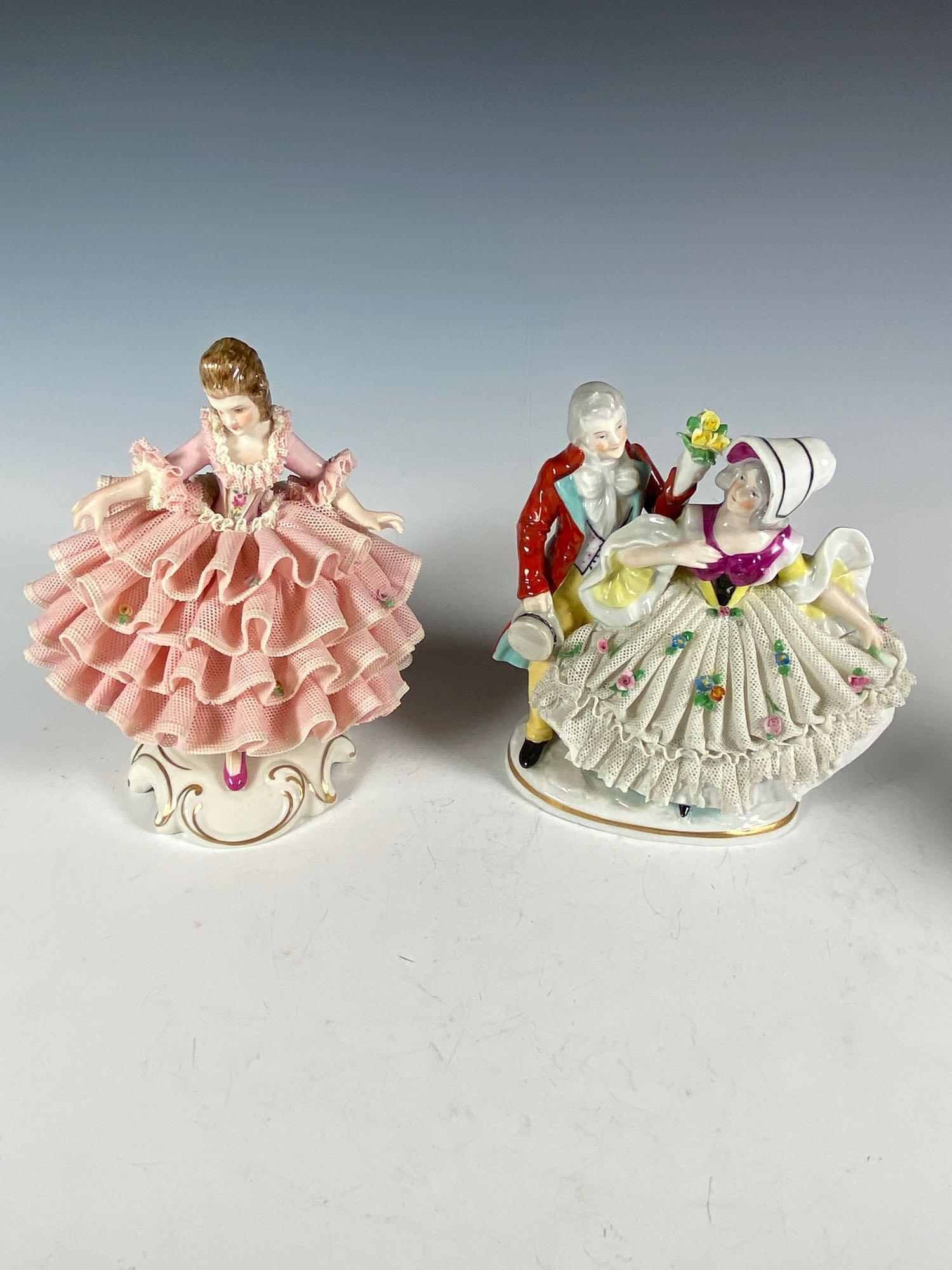 Dresden and Capodimonte Porcelain Figurines: Includes Dresden lace figurine in pink dress with some loss to lace on back and capodimonte man courting woman withheavy lace losses, see photos.. Approx. 5 3/4" tall.