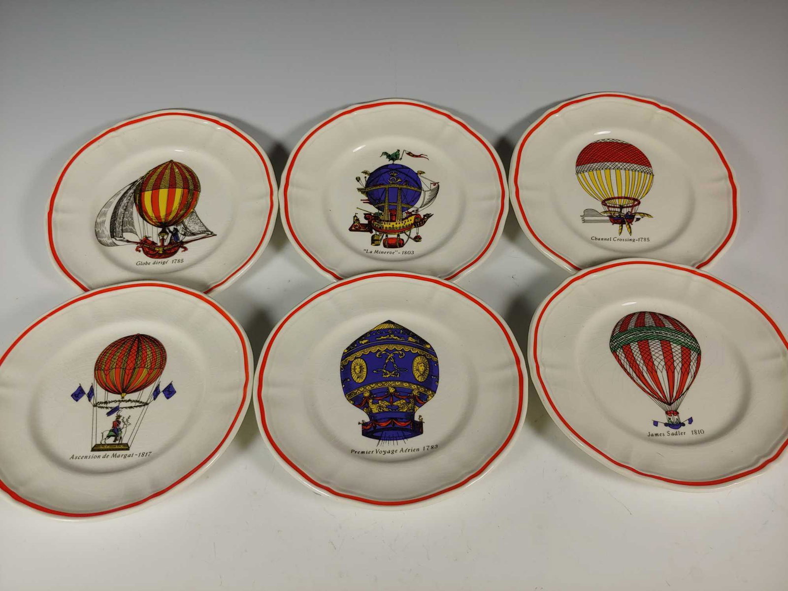 Set of 6 Longchamp France Hot Air Ballon Plates: Set of 6 Longchamp France Hot Air Ballon Plates each with different titles and scenes. Approx. 6 1/2" diameter. In very good condition with no signs of use, see photos.
