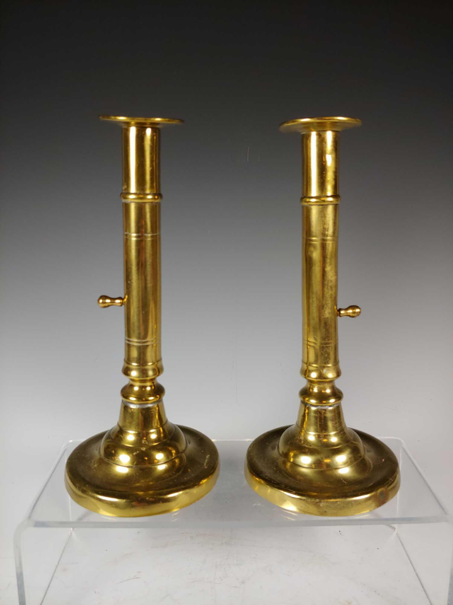 18th Century GEORGIAN Candle Sticks: Pair of fine English brass push up candle sticks. Ca. 1780 Georgian, England, standing approx 9" tall. Working and age appropriate condition as shown.