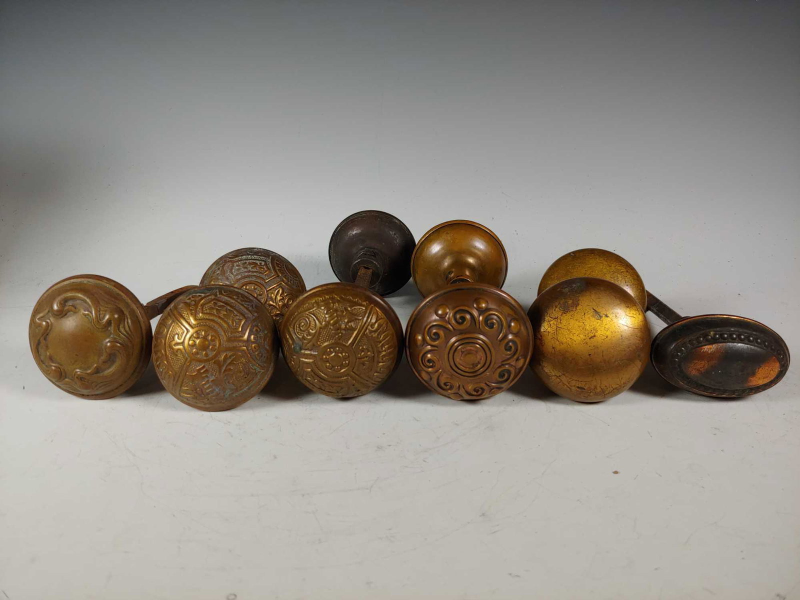 Collection of 10 Antique Brass Door Knobs: Collection of 4 matching sets and 2 single knobs. In age appropriate condition with signs of use, see photos.