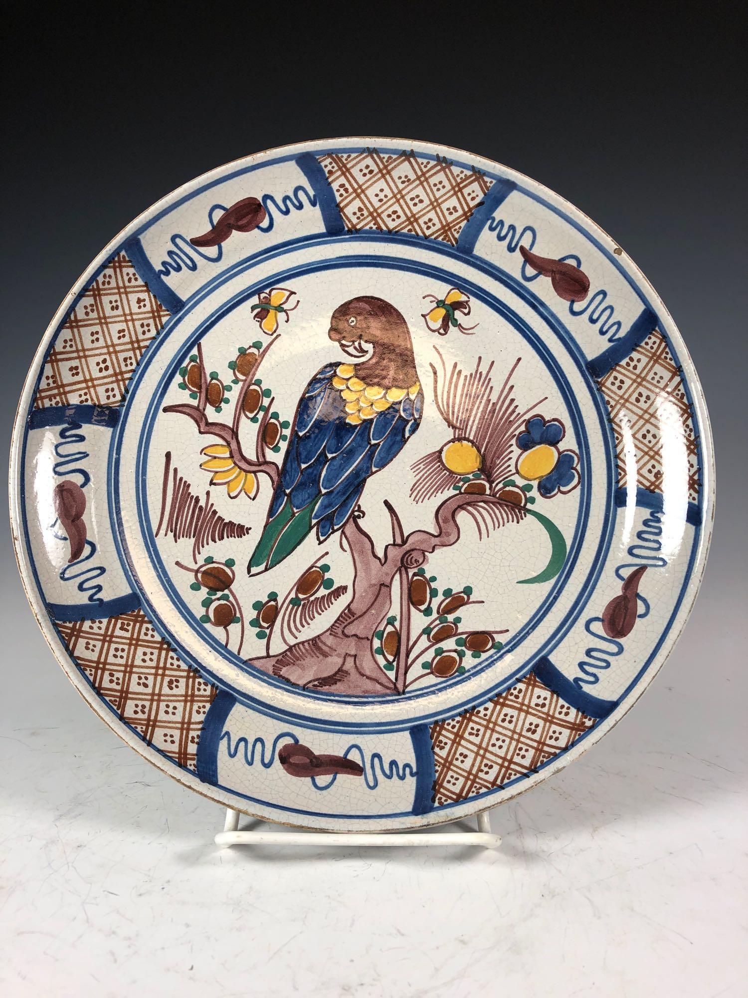 17th C. RARE Delft Dutch Plate: Very Early and UNUSUAL DELFT Dutch polychrome 9.5" plate with bird birched upon a tree branch having butterflies and birds. Exceptional example of 17th century Dutch Delft pottery