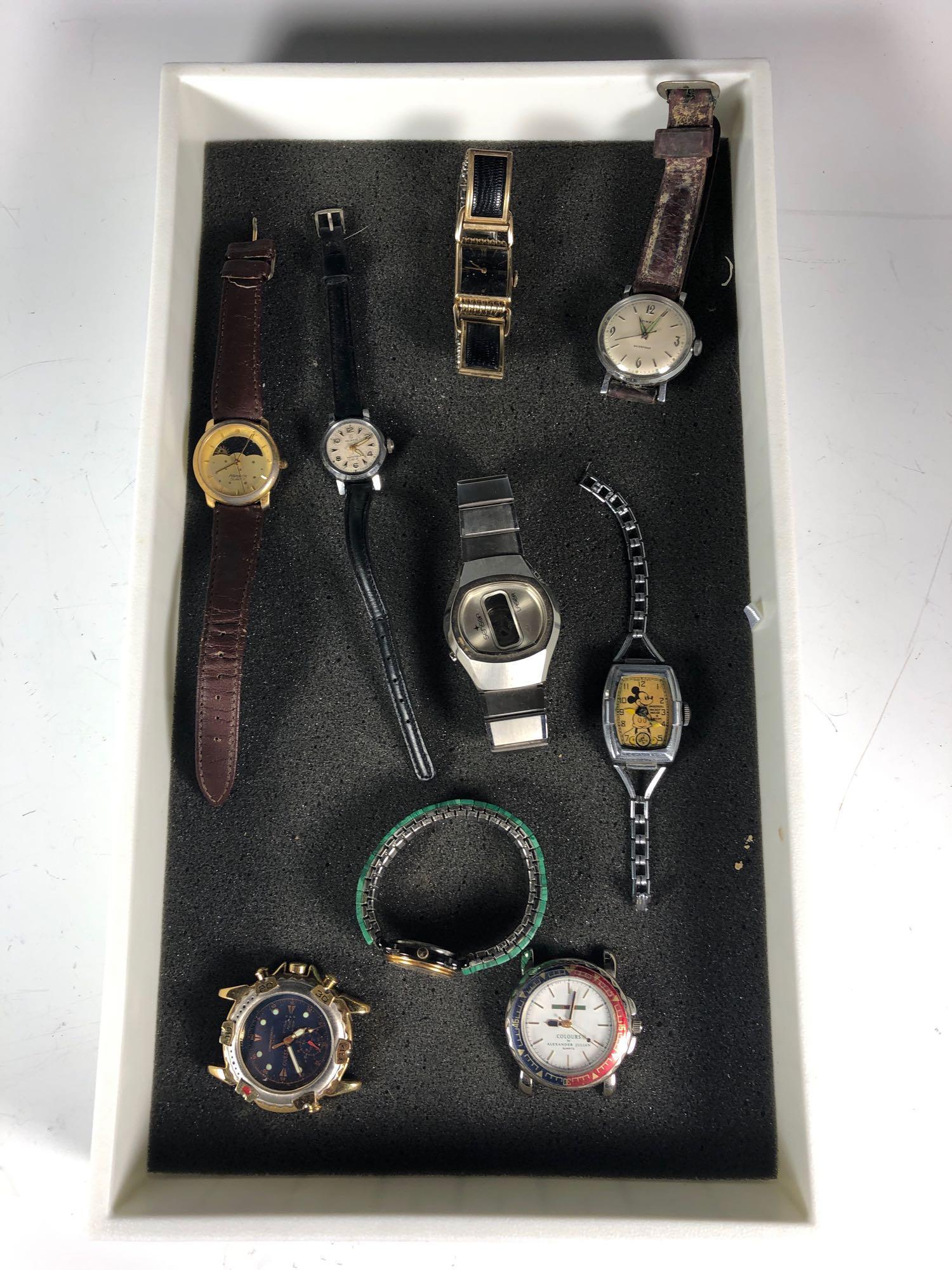 Group Various Wrist Watches: Mens and womens wrist watches as is. Includes vintage Mickey mouse Ingersoll by Walt Disney lacking crystal glass face, Square face Lord Elgin ladies watch, Swiss ladies HELBROS Invincible wrist watch