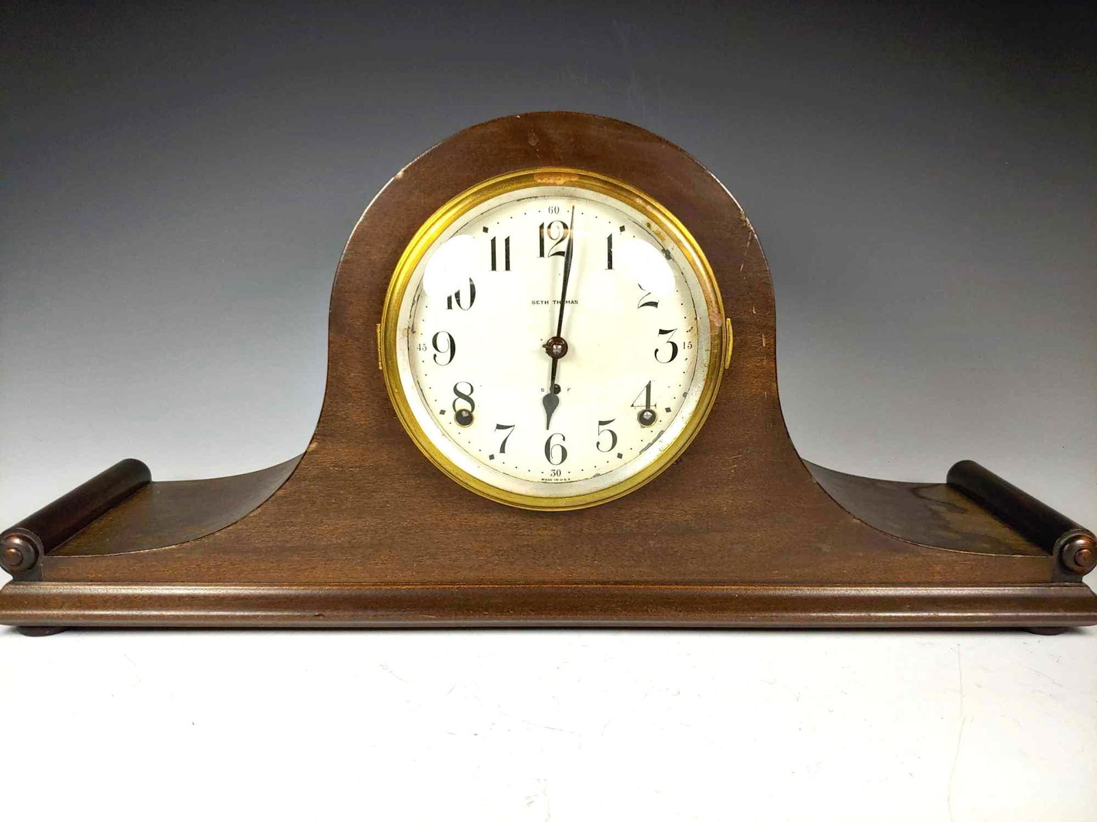 Antique Seth Thomas Mantle Clock: Early 20th century Set Thomas mantle clock. Approx. 20" wide by 9" tall and 5" deep. Having some water staining and pitting to face, see photos.