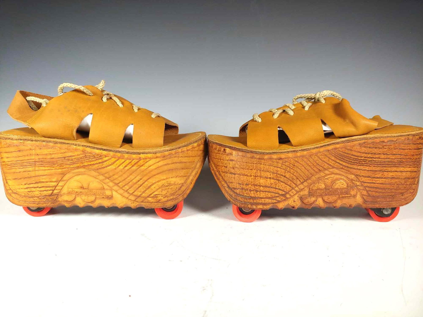 1970s Retro Platform Sandal Roller Skates NIB: Ready to roll!! Surprise your neighbors as you go skating along with these never used 1970s vintage skootskates new in box as shown. They have tan leather tie uppers, wood platform sandals with comfor