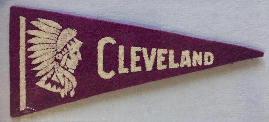 Rare Mini Cleveland Indians Purple Headdress Pennant: Guessing this 5-1/4 inch long felt pennant is from the 1940's.Â White headdress mascot and text "CLEVELAND" Very clean condition.