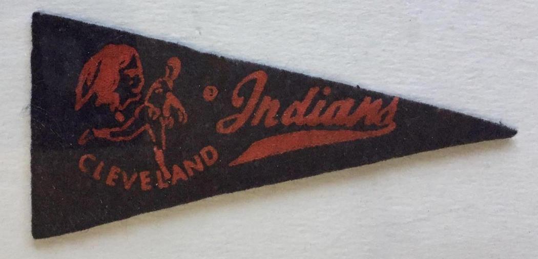 Ultra Rare Mini Cleveland Indians 1950's Pennant: Guessing this 4-1/2 inch long blue pennant with red design is from the 1940's.Â There are versions with the script Indians, version with the player, but don't know that this version with the script
