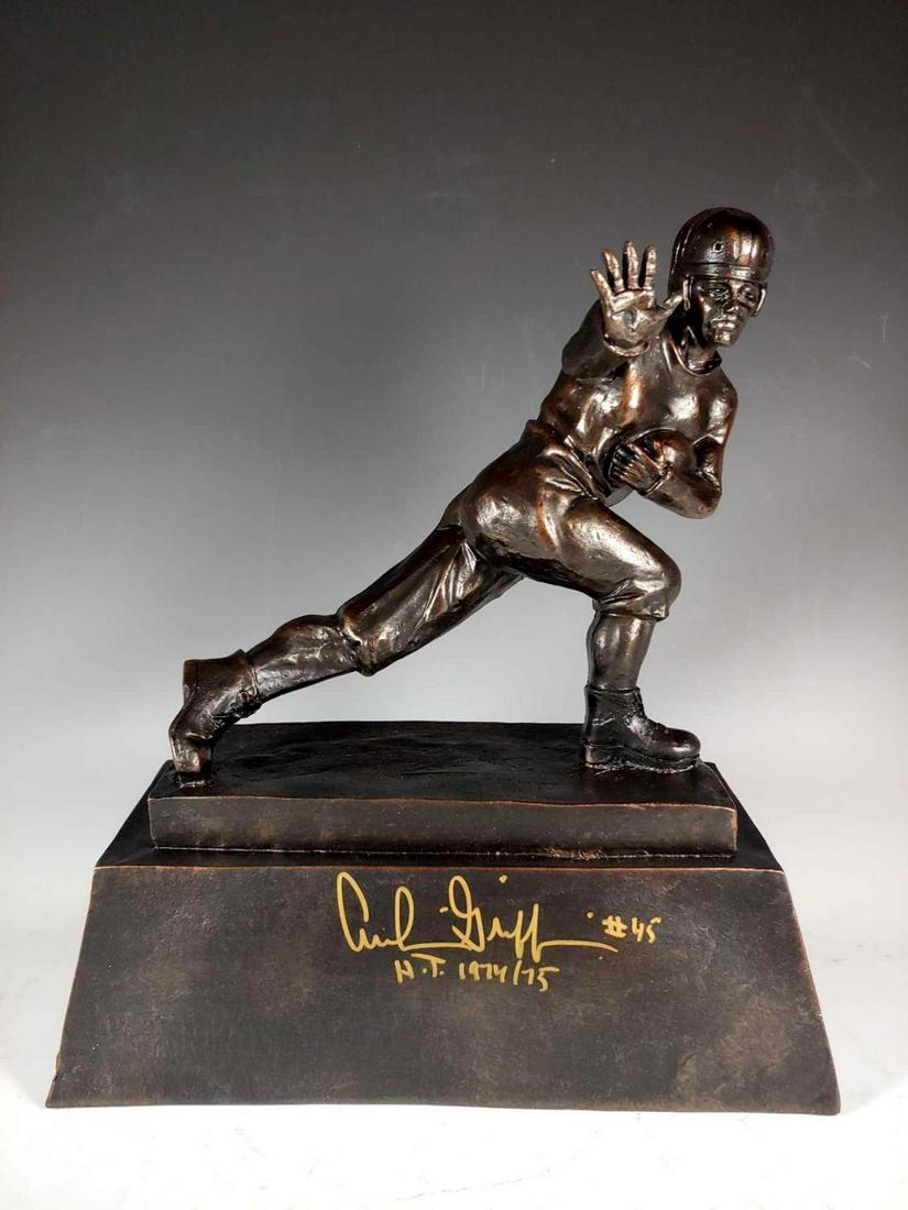 Archie Griffin Autographed Heisman Trophy Replica: Very cool replica trophy that will definitely be a conversation piece in your collection.Â Gold signature along with inscriptions by Archie.Â Comes with a certificate from JSA.