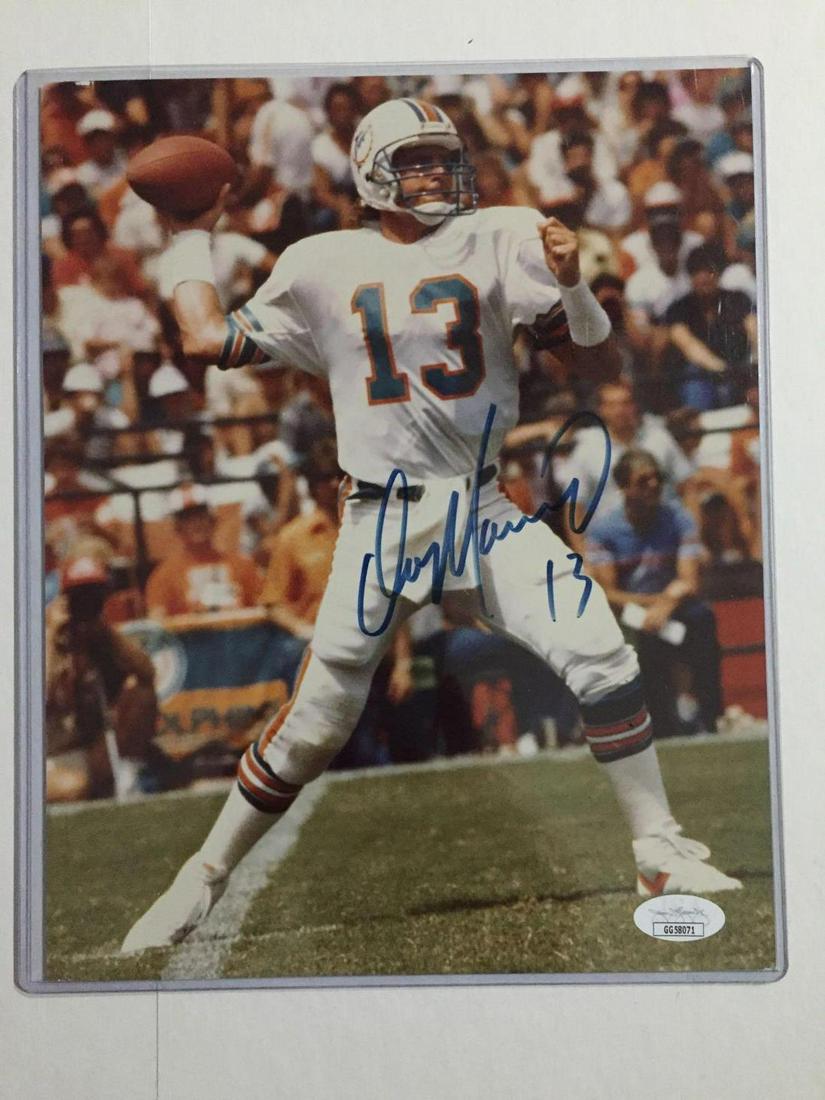 Dan Marino Autographed Photo Miami Dolphins JSA: Color action photo of Dan.Â Huge blue marker signature.Â JSA certificate.