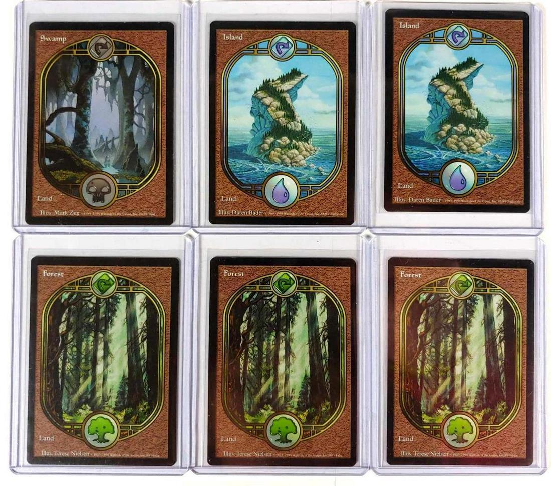 Magic The Gathering Group of Land Cards (6): Three different Land cards dated 1998; Island(2), Swamp, Forest(3) in nice condition.Â May have been used a few times.