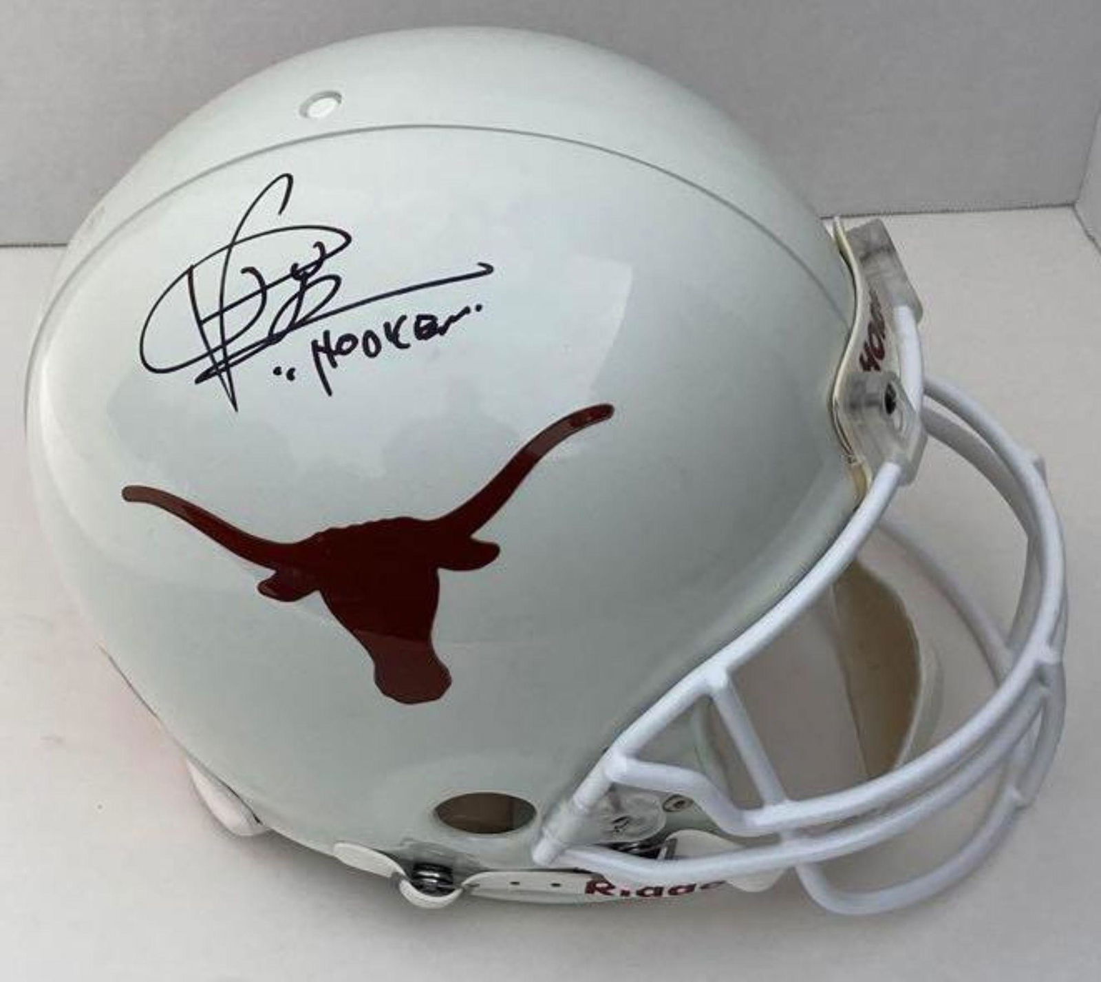 Vince Young Signed U of Texas Helmet: Full sized Texas Longhorns helmet signed in black marker by the legend himself along with "Hook 'em" inscription. College football fans and Texan fans cherish the man and former top draft pick. Tri-St