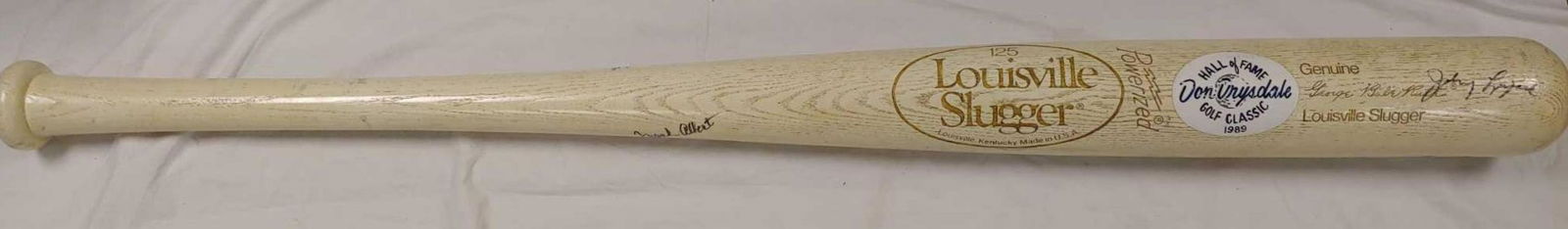Babe Ruth Giant 66" Bat - Autographed: This popular bat was a marketing effort in the 1980's and it went very well as everyone wants to think big! This particular bat is indeed autographed. Our best guess is that it was a prize or auction