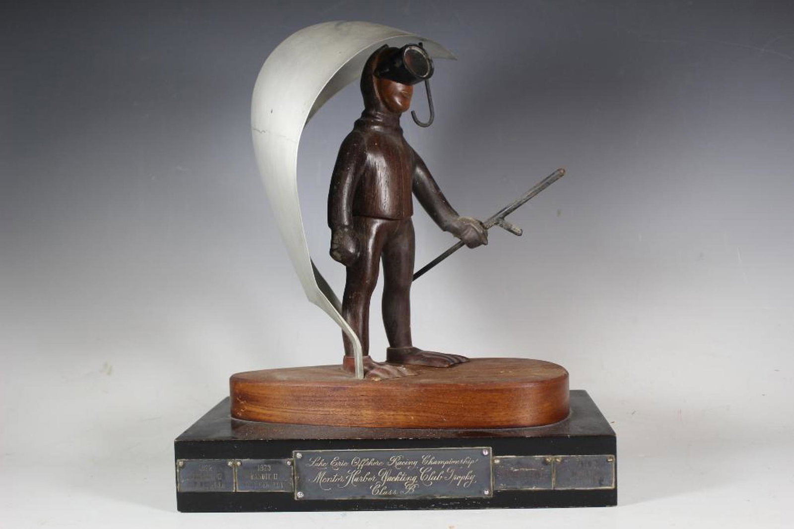 20th Century Lake Erie Offshore Racing Trophy: Unqiue mid-late Century (20th century) Class B Lake Erie Offshore Mentor Harbor Racing trophy with scuba man as shown. See photos. Dates and brass plaques as shown. Measuring approx 13.5" tall x 11" w