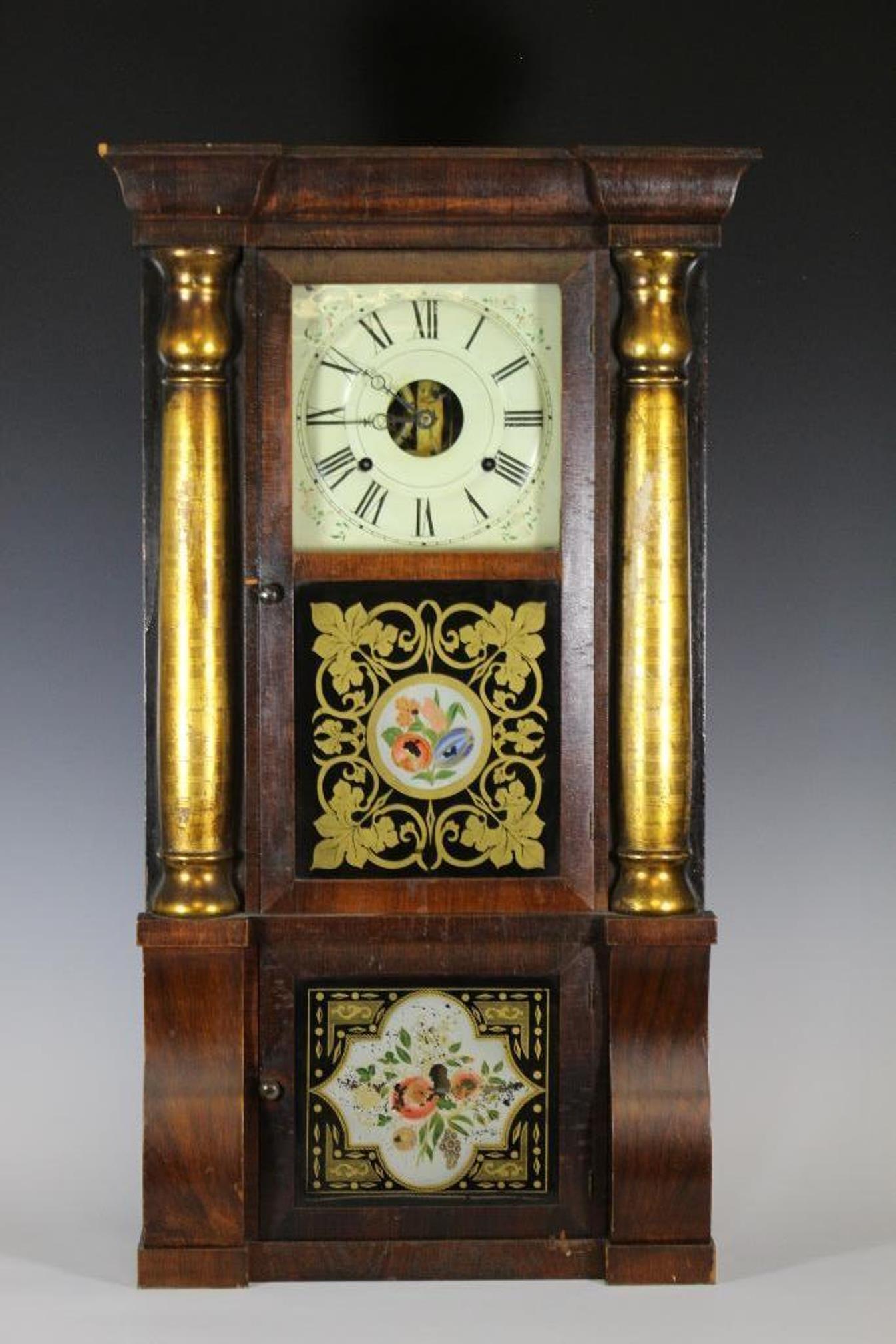 19th Century Seth Thomas Floral Column Shelf Clock: Mid 19th Century Seth Thomas eight day shelf clock with some loses to gilt pilasters. Separate top and bottom face doors both with reverse painted floral design. Hand painted metal face with Roman num