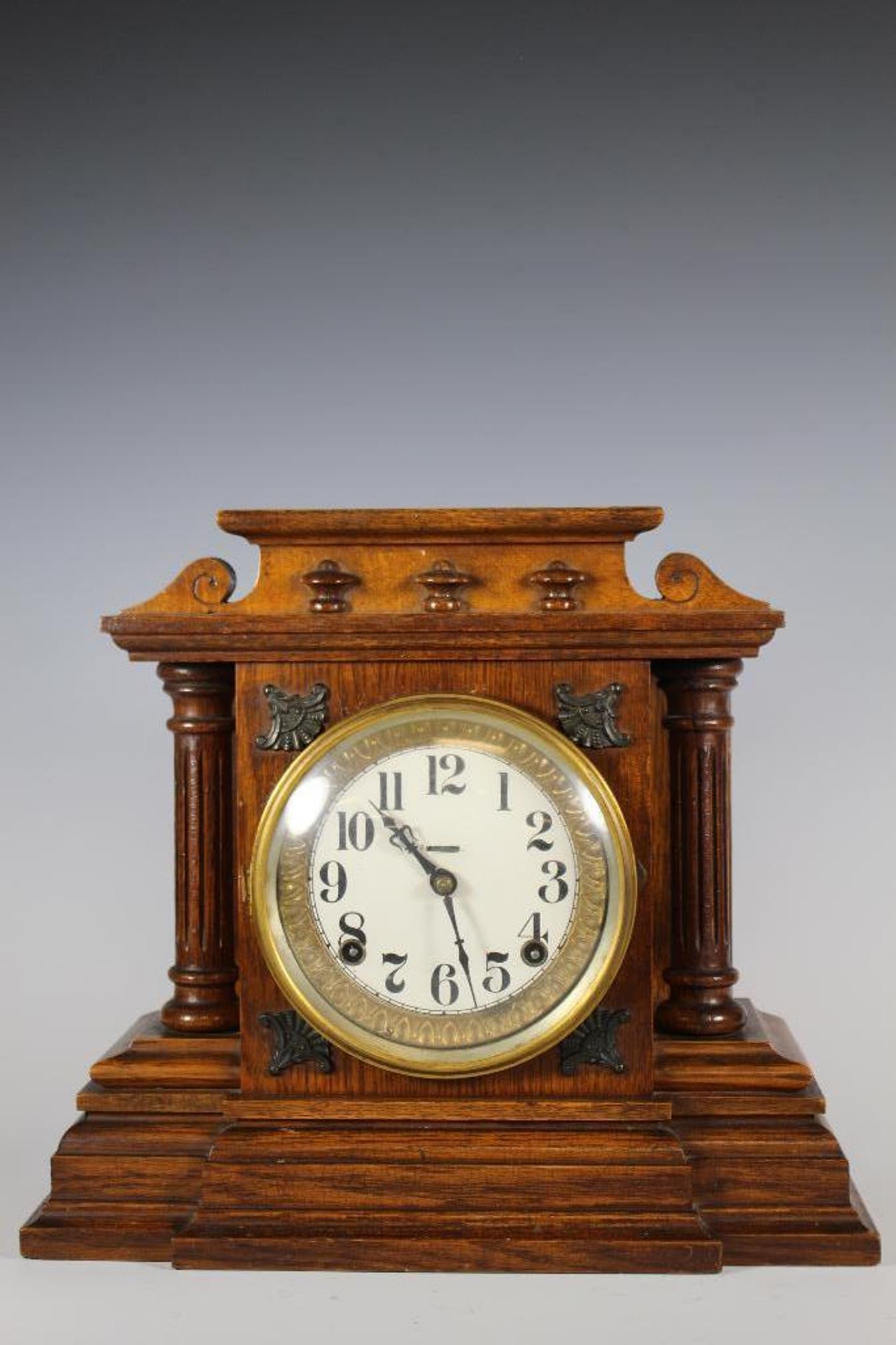 Late 19th Century Ingram Oak Mantle Clock: Late Victorian Oak mantle clock with fluted columns sides and round dial by the Ingram clock company. Currently winds and chimes, key present as shown. Measuring approx 13" tall x 14.5" wide x 6" deep