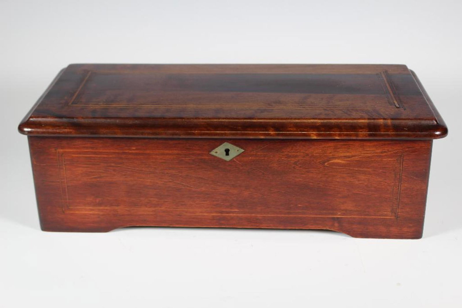 19th Century Swiss Cylinder Music Box: A Swiss cylinder music box having a rectangular rosewood case with a hinged top; playing 8 airs on a 6 in. cylinder with nickel comb, interior hand crank. Spring wound action has Repeat/Change and Pla