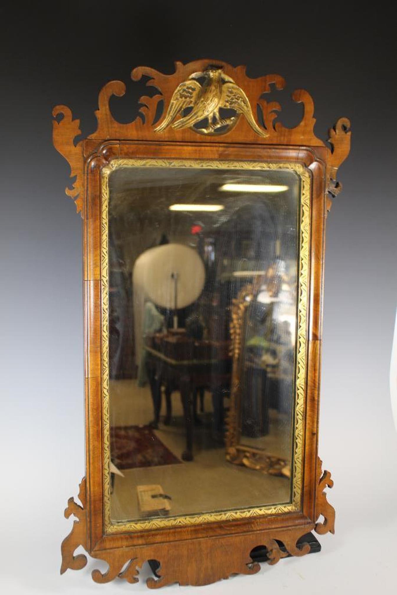 18th Century English Chippendale Mirror: Quality 18th century English Chippendale PERIOD wall mirror with caved gilt Phoenix bird crest, finely hnd carved frame with gold gilt mirror interior rim. Mahogany, 1780-90 and measuring approx 34" t