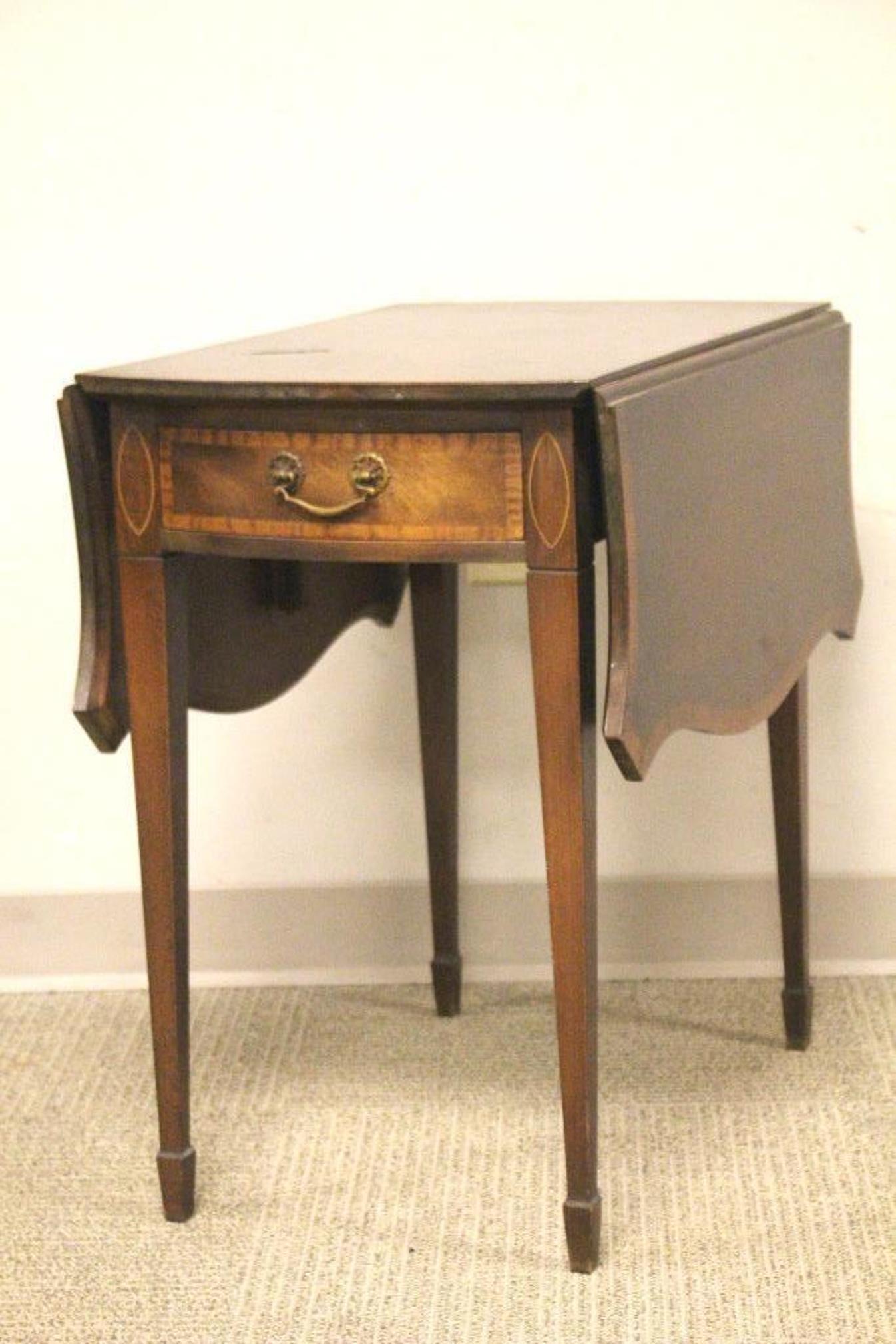 Banded Mahogany Drop Leaf Table: 1940's Johnson Handly Johnson mahogany drop leaf table seated on 4 tappered legs. Approx. 26" tall by 17" wide with leaves down by 26" deep. Light surface scuffs and wear, see photos.