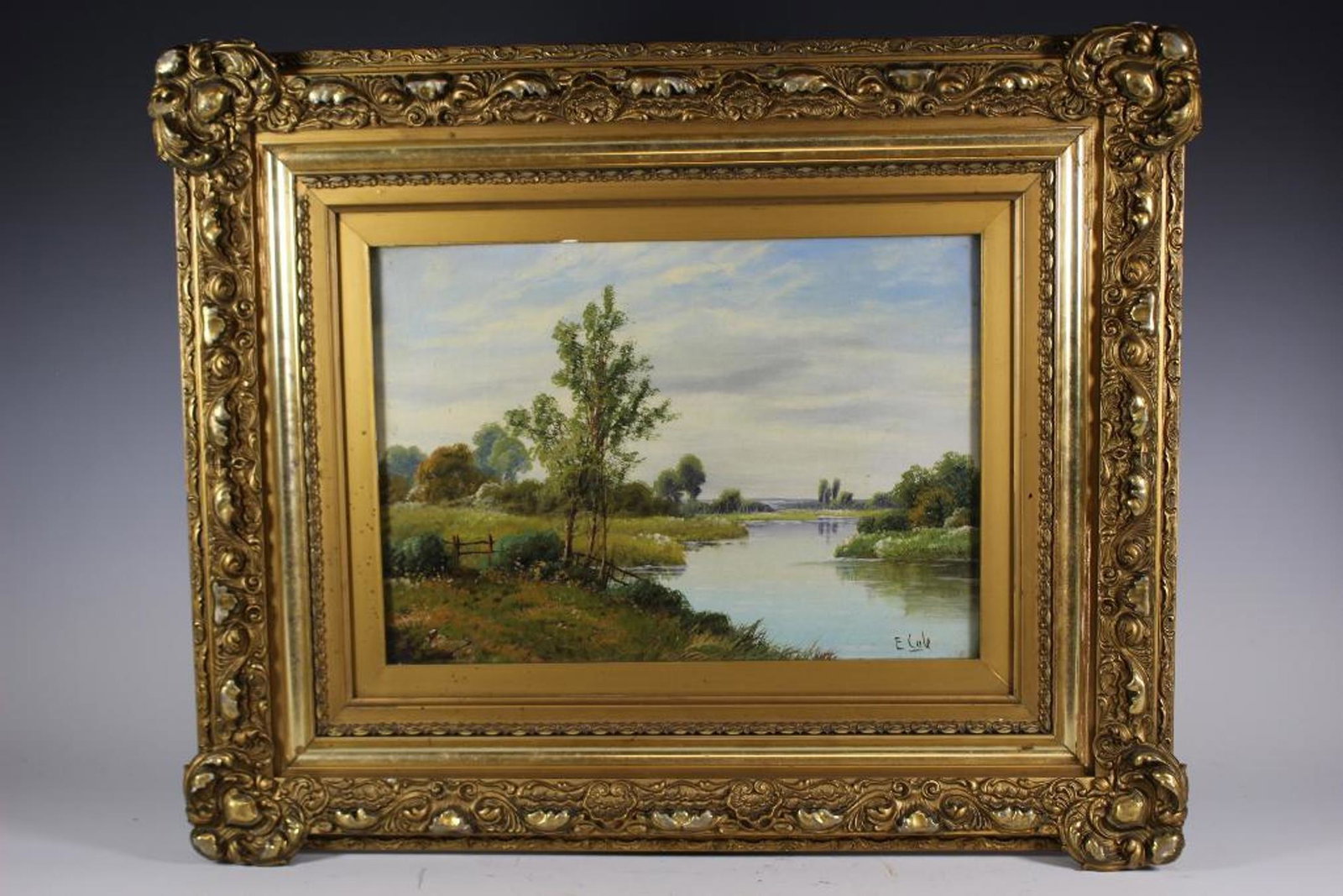 Edwin Cole (British, 1868-1935), River Landscape: Signed Edwin Cole (British, 1868-1935), river landscape oil painting on canvas. Painting contained in period gilt frame and under glass. Measuring approx 23" wide x 18" tall including the frame. Sight