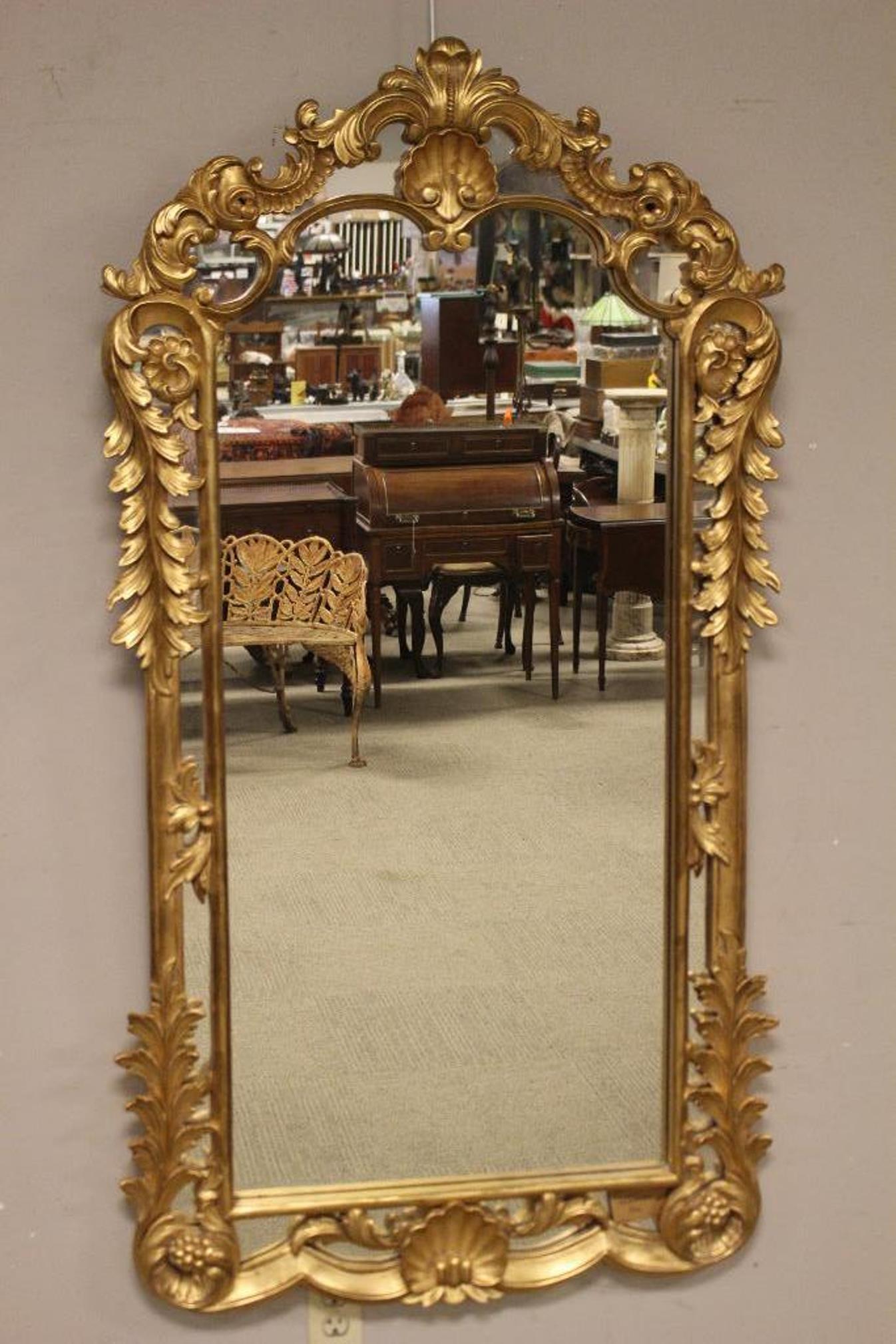 Large Impressive Carved Gilt Wood Italian Mirror: Impressive hand carved and gilt wood Italian wall mirror. Fine quality 19th century Italian mirror measuring approx 62" tall x 33" wide. Fine example of Italian carving. Exceptional condition as shown