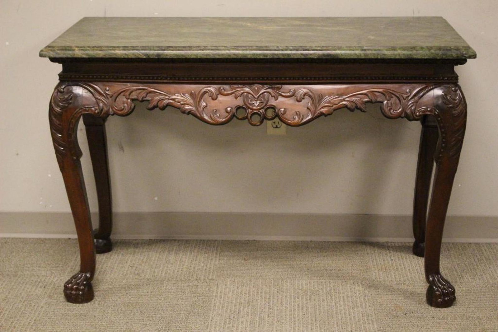 Chippendale Style Marble Top Foyer Table w Ball and: Fine quality 20th century Chippendale style foyer or hall table with green beveled marble top and ball and claw feet. Seated on four queen ann legs. Measuring approx 32" tall x 48" wide x 24" deep. Co