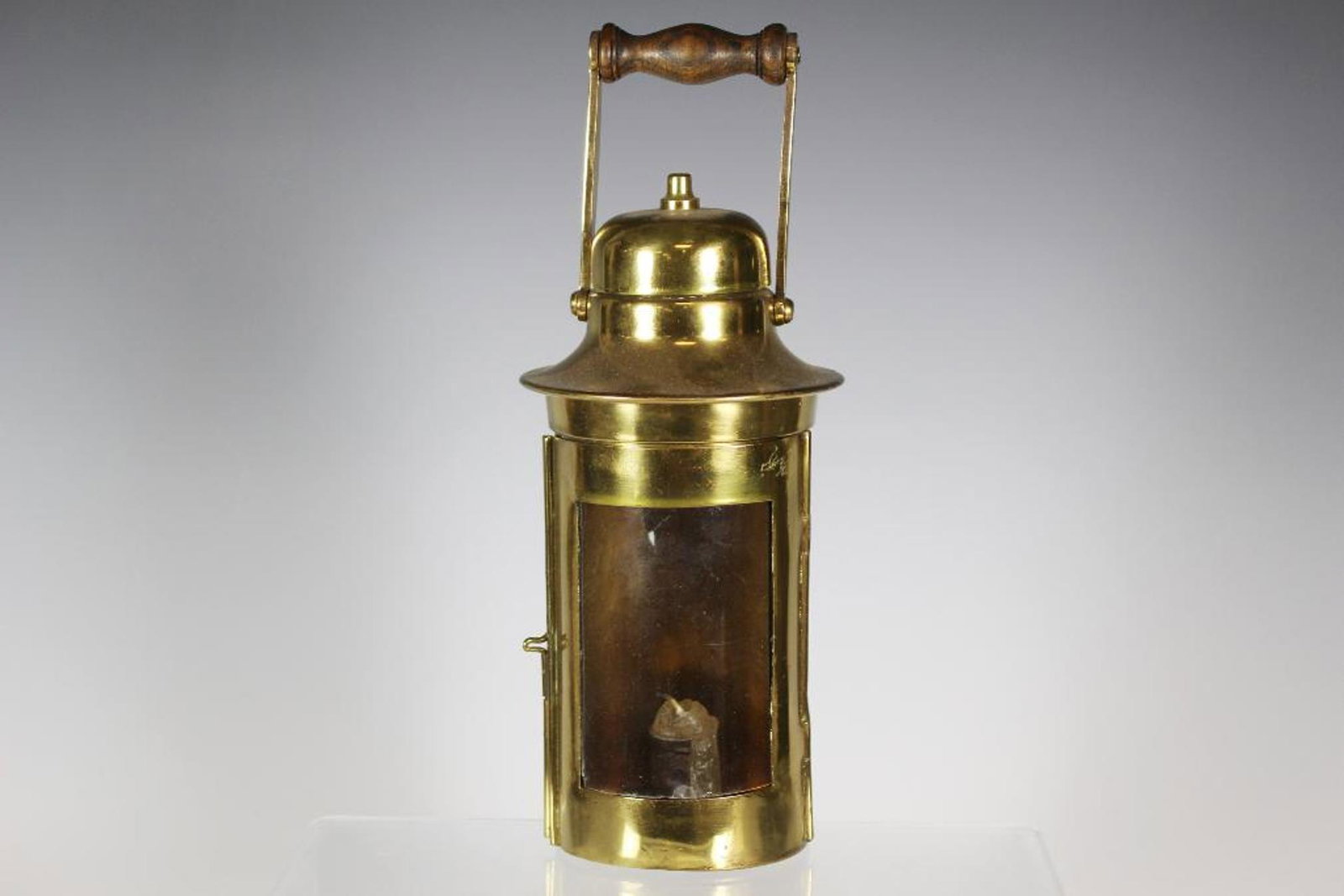 18th Century French Brass Lantern: Fine example of late 18th or possibly turn of the 19th century French or English glass front brass lantern. Pin hinge with oak turned wood handle. Standing approx 10" tall. Polished and small brass he
