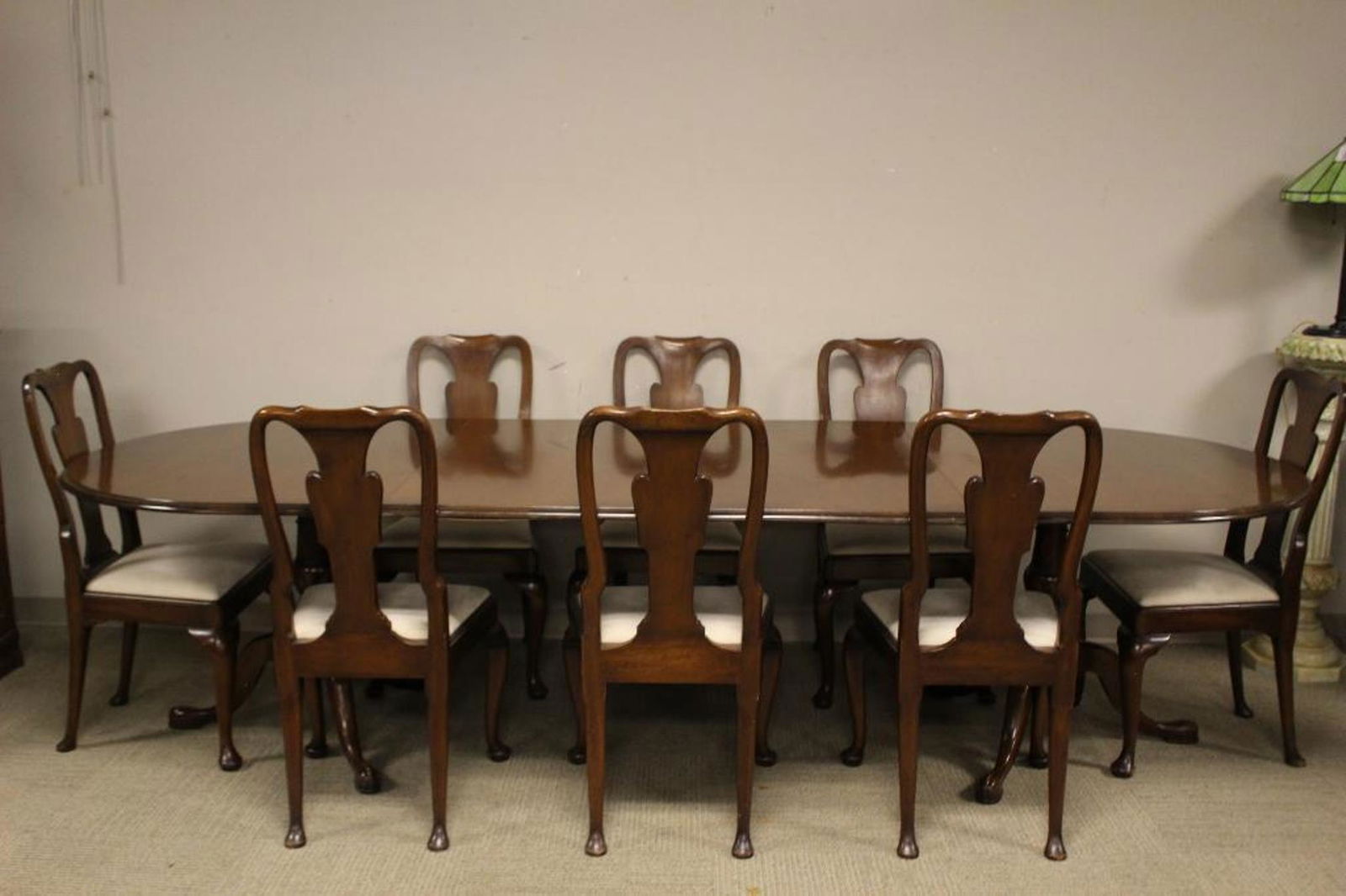 19th Century English Queen Anne Dining Table and Chairs: Mid 19th century mahogany table and chairs. Queen Anne set comprising of Eight (8) chairs, double pedestal and leaves. Chairs measuring approx 38" tall x 20" wide x 18" deep and the table approx 29.5"
