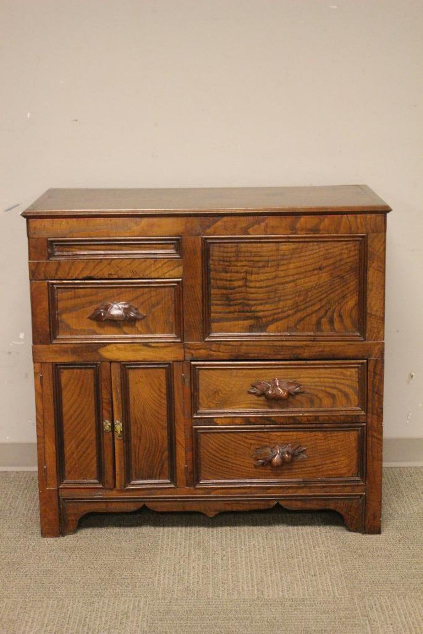 Late 19th century Oak Liquor Cabinet: Victorian oak left top bar server or liquor storage cabinet. Painted interior, carved mustache style wood pulls and blind door storage areas. Measuring approx 37" tall x 39" wide x 18" deep. See photo