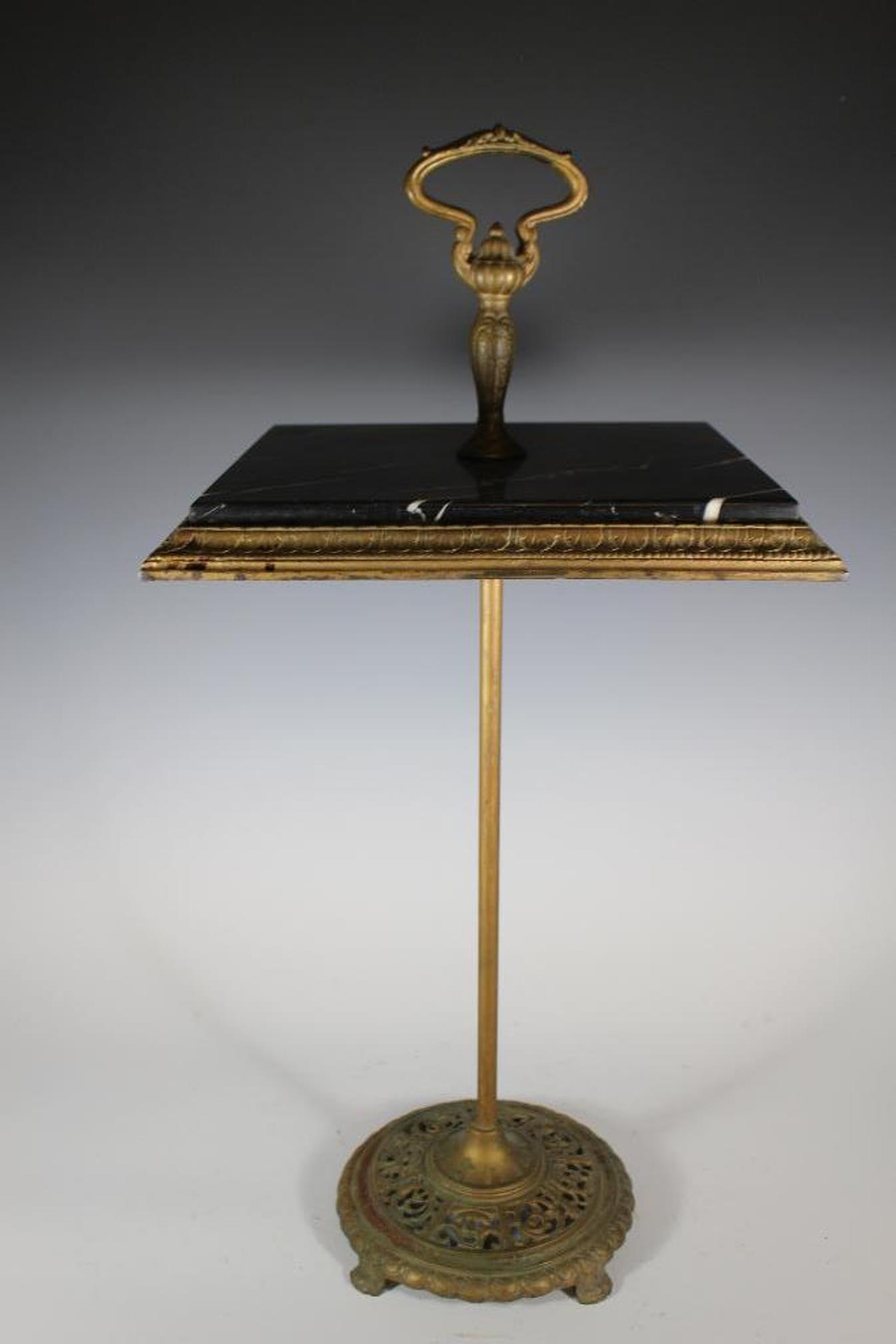 Brass Art Deco Marble Top Cigarette Table: Early 20th century brass cigarette table with black marble top. Approx. 28" tall by 14" square top. In good condition, see photos.