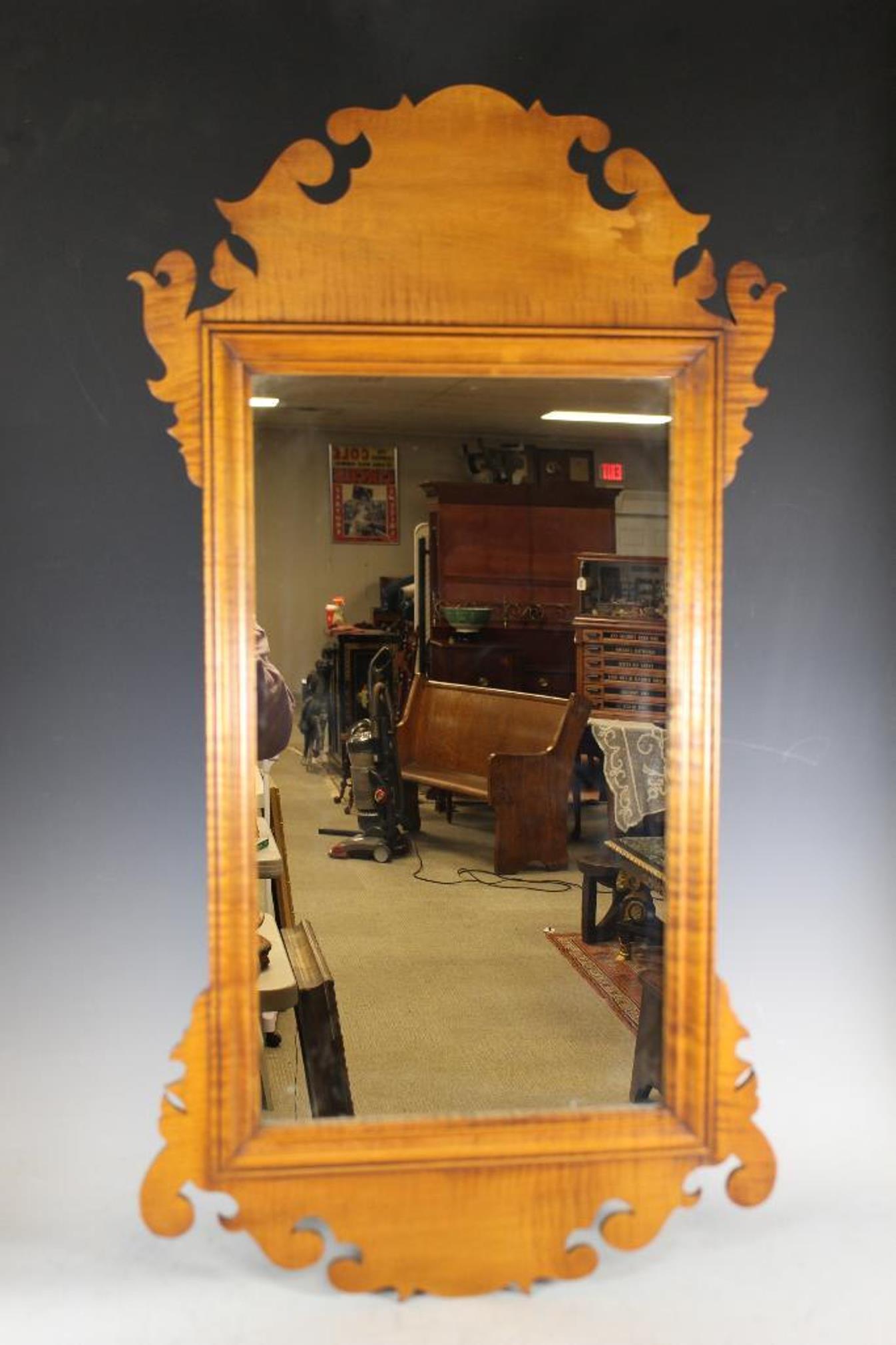 Fine Eldred Wheeler Tiger Maple Mirror: Chippendale style tiger maple mirror by Eldred Wheeler, and with label verso. Measuring approx 38" x 20".