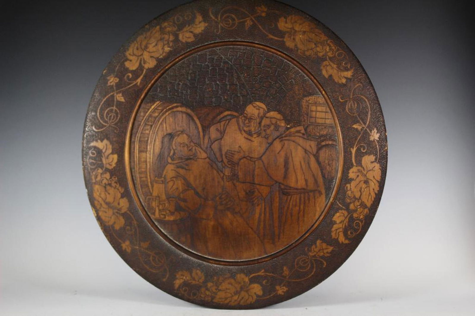 Flemish Art Burnt Wood Carved Wall Plaque: Large 24" diameter burnt wood wall plaque with subject depicting bishops or pope figures healing a gentlemen. Condition is very good. Circa 1900-1910. See photos.